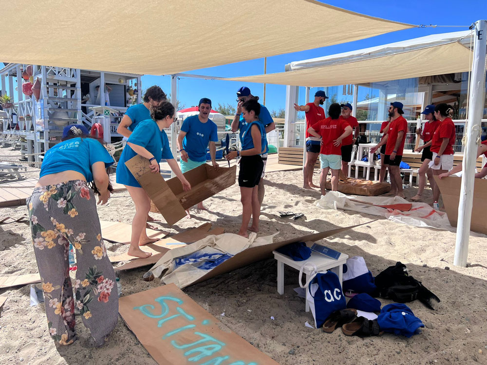 Cardboard-boating by the sea: a dynamic and engaging summer team building activity - 1